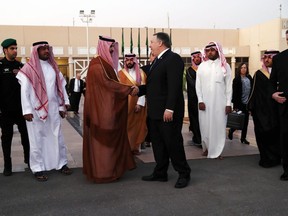 U.S. Secretary of State Mike Pompeo, center right, shakes hands with a Saudi official before leaving Riyadh, Saudi Arabia Wednesday, Oct. 17, 2018.