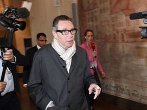 In this Sept. 19, 2018, file photo, Jean-Claude Arnault arrives at the district court for the start of court proceedings in Stockholm.