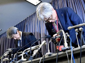 KYB Corp. Senior Managing Executive Officer Keisuke Saito, right and its affiliated firm Kayaba System Machinery Co., Ltd. President Shigeki Hirokado bow in apology during a press conference in Tokyo Friday, Oct. 19, 2018. The Japanese government has ordered the company that falsified quality data for earthquake "shock absorbers" used in hundreds of buildings to speed up an investigation and fix any problems quickly.