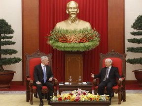 FILE - In this  Jan. 25, 2018, file photo, U.S. Secretary of Defense Jim Mattis, left, listens during talks with Vietnam's Communist Party General Secretary Nguyen Phu Trong in Hanoi, Vietnam. Mattis is planning to make his second visit to Vietnam this year, signaling how vigorously the Trump administration is trying to counter China's military assertiveness in the South China Sea by building up relations with smaller nations in the region.