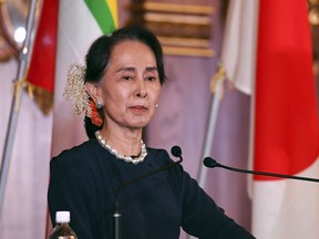 Myanmar's State Counsellor Aung San Suu Kyi delivers her speech during the joint press remarks with Japanese Prime Minister Shinzo Abe following their bilateral meeting at the Akasaka Palace state guest house in Tokyo Tuesday, Oct. 9, 2018.