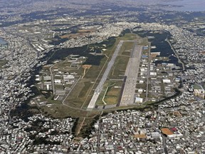 This Jan. 27, 2018 aerial photo shows U.S. Marine Air Station Futenma in Ginowan, Okinawa, southern Japan. The election of an outspoken critic of the American military presence in Okinawa throws not question plans for a new United States air force base on the islands and possibly the future of all the facilities which have been there for decades.(Kyodo News via AP)