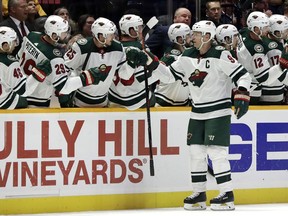 Minnesota Wild center Mikko Koivu (9), of Finland, celebrates after scoring a goal against the Nashville Predators in the second period of an NHL hockey game Monday, Oct. 15, 2018, in Nashville, Tenn.