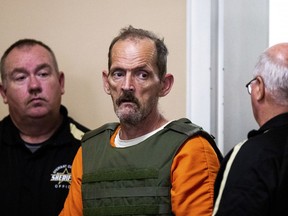Kirby Gene Wallace enters the courtroom during his first appearance at the Stewart County Courthouse Tuesday, Oct. 9, 2018, in Dover, Tenn. Wallace, a multiple-murder suspect who led Tennessee law enforcement on an intense 7-day manhunt was captured without a struggle Friday morning, Oct. 5, in a wooded area about two hours northwest of Nashville. Wallace is wanted in two counties on charges that include murder, arson and kidnapping.