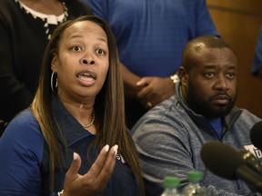 Staci Abercrombie, left, talks about her son, Tennessee State football player Christion Abercrombie, during a news conference Wednesday, Oct. 3, 2018, in Nashville, Tenn. Abercrombie suffered a severe head injury in an NCAA college football game last week. At right is Derrick Abercrombie, Staci's husband.