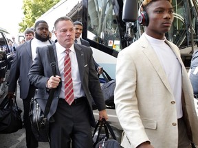 Former Tennessee head football coach Butch Jones, center,  arrives before an NCAA college football game between Alabama and Tennessee Saturday, Oct. 20, 2018, in Knoxville, Tenn.