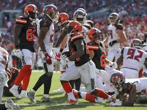 Cleveland Browns running back Nick Chubb (24) scores on a 1-yard touchdown run against the Tampa Bay Buccaneers during the second half of an NFL football game Sunday, Oct. 21, 2018, in Tampa, Fla.