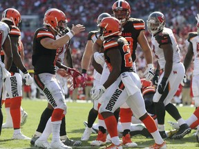Cleveland Browns running back Nick Chubb (24) celebrates with quarterback Baker Mayfield after scoring on a 1-yard touchdown run against the Tampa Bay Buccaneers during the second half of an NFL football game Sunday, Oct. 21, 2018, in Tampa, Fla.