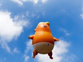 The 'Trump Baby' blimp flies over Parliament Square in London in July.