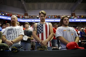 Trump supporters pray at a rally in Southhaven, Miss., on Oct. 2, 2018. Some dismiss Trump???s clarion call to Make America Great Again as sheer jingoism, but to minimize the visceral embrace of his anti-globalist message is to miss its larger significance, Harper writes. (AP Photo/Evan Vucci)