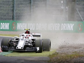 Sauber driver Charles Leclerc of Monaco steers his car on the dirt during the third practice session for the Japanese Formula One Grand Prix at the Suzuka Circuit in Suzuka, central Japan, Saturday, Oct. 6, 2018.