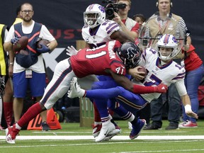 Buffalo Bills quarterback Josh Allen (17) is hit by Houston Texans linebacker Zach Cunningham (41) during the second half of an NFL football game, Sunday, Oct. 14, 2018, in Houston.