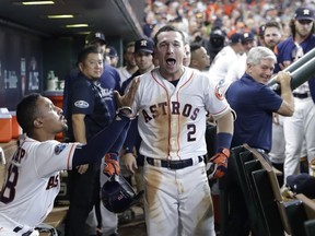 Houston Astros' Alex Bregman (2) celebrates after hitting a solo home run against Cleveland Indians' pitcher Trevor Bauer during the seventh inning of Game 2 of a baseball American League Division Series, Saturday, Oct. 6, 2018, in Houston.