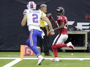 Houston Texans cornerback Johnathan Joseph (24) scores pass Buffalo Bills quarterback Nathan Peterman (2) after intercepting Peterman's pass during the second half of an NFL football game, Sunday, Oct. 14, 2018, in Houston.