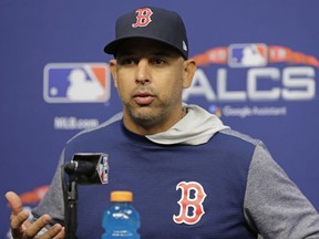 Boston Red Sox manager Alex Cora speaks during a news conference at a baseball workout Monday, Oct. 15, 2018, in Houston. The Red Sox will face the Houston Astros in Game 3 of the baseball American League Championship Series Tuesday Oct. 16 2018.