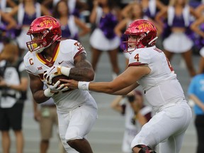 Iowa State running back David Montgomery (32) takes the hand off from quarterback Zeb Noland (4) in the first half of a NCAA college football game in Fort Worth, Texas, Saturday, Sept. 29, 2018.