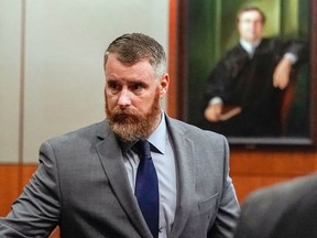 FILE - In this June 13, 2018, file photo, Terry Thompson, accused of fatally choking John Hernandez, left, is shown in court in Houston. Thompson is standing trial again on a murder charge in the strangling of Hernandez, a man he and his wife confronted outside a Houston-area restaurant in 2017. Thompson's first trial in June ended in a mistrial.