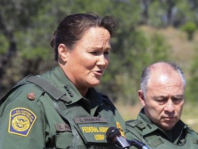 In this April 26, 2018 file photo, then-U.S. Border Patrol Acting Chief Carla L. Provost, left, meets with members of the media south of Falfurrias, Texas. Immigration authorities detain and process thousands of people every month who cross the U.S. border without permission. But when detained people try to make claims of misconduct, advocates say they run into a series of hurdles and issues that make their complaints difficult to substantiate. Border Patrol chief Carla Provost said in a recent interview that her agency takes any allegations against any of its 19,000 agents 'very, very seriously.'