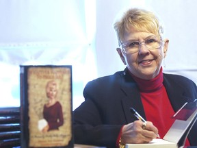 FILE - In this Jan. 11, 2008, file photo, Peggy Sue Gerron unveils her new book "What Ever Happened to Peggy Sue" during a press conference in Tyler, Texas. Gerron, the Texas woman who inspired the 1958 Buddy Holly song "Peggy Sue" has died at a Lubbock hospital. Gerron Rackham of Lubbock died Monday, Oct. 1, 2018, at University Medical Center. She was 78.