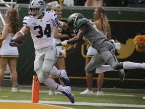 Kansas State Alex Barnes, left, scores past Baylor Kalon Barnes, right, during the first half of an NCAA college football game, Saturday, Oct. 6, 2018, in Waco, Texas.