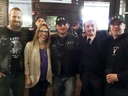 United Conservative Party Edmonton-West Henday nomination candidate Nicole Williams with members of the Soldiers of Odin during a constituency association pub night Friday at Brown’s Social House.