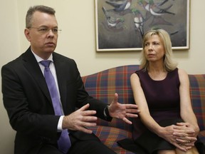 Pastor Andrew Brunson, left, gestures as his wife, Norine, listens during an interview at the headquarters of Christian Broadcasting Network in Virginia Beach, Va., Friday, Oct. 19, 2018. Brunson was recently released from prison in Turkey.