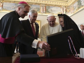 Chile's President Sebastian Pinera and his wife Cecilia Morel exchange gifts with Pope Francis as they meet  during a private audience at the Vatican, Saturday, Oct. 13, 2018.