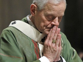 In this Wednesday, Oct. 20, 2010 file photo, Archbishop Donald Wuerl prays as he celebrates Mass at the Cathedral of Saint Matthew the Apostle in Washington.