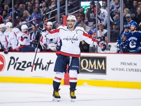 Washington Capitals' Alex Ovechkin, of Russia, celebrates his second goal against the Vancouver Canucks during the third period of an NHL hockey game in Vancouver, on Monday October 22, 2018.