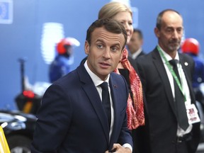 French President Emmanuel Macron arrives for an EU summit at the Europa building in Brussels, Thursday, Oct. 18, 2018. EU leaders meet for a second day on Thursday to discuss migration, cybersecurity and more discussion on stalled Brexit talks.