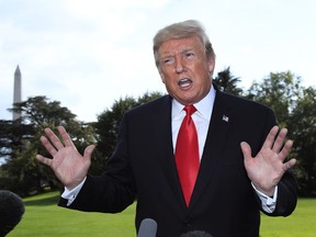 President Donald Trump speaks to reporters on the South Lawn of the White House in Washington, Tuesday, Oct. 9, 2018,  before leaving for Council Bluffs, Iowa to speak at a rally.