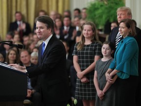 President Donald Trump listens to Justice Brett Kavanaugh speaks during the ceremonial swearing-in ceremony of Kavanaugh as Associate Justice of the Supreme Court of the United States in the East Room of the White House in Washington, Monday, Oct. 8, 2018. Kavanaugh is accompanied by his wife Ashley Kavanaugh, third from left, and children Margaret, second from left, and Liza.