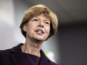 FILE - In this Oct. 16, 2018, file photo, U.S. Sen. Tammy Baldwin, D-Wis., addresses supporters and workers at the Democratic Party of Rock County office in downtown Janesville, Wis. President Donald Trump makes a campaign visit to Wisconsin with Republicans growing increasingly nervous about the prospects of Gov. Scott Walker winning a third term, let alone defeating well-positioned incumbent Democratic Baldwin. Trump returns Wednesday, Oct. 24, to a rural part of the state that he easily won by double digits in 2016.