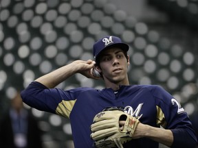 Milwaukee Brewers' Christian Yelich warms up before Game 1 of the National League Championship Series baseball game against the Los Angeles Dodgers Friday, Oct. 12, 2018, in Milwaukee.