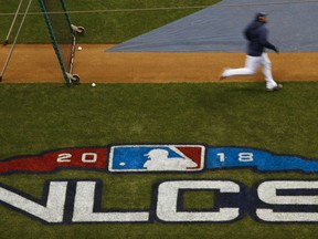 Milwaukee Brewers' Jesus Aguilar runs bases at practice for Game 1 of the National League Championship Series baseball game against the Los Angeles Dodgers Thursday, Oct. 11, 2018, in Milwaukee.