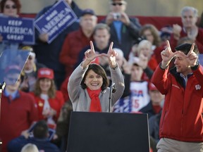 Senate candidate, current Wisconsin State Senator Leah Vukmir R-Wis. and House Speaker Paul Ryan make "W" hand signs for Wisconsin during a rally Wednesday, Oct. 24, 2018, in Mosinee, Wis. The rally will be headlined by President Donald Trump.