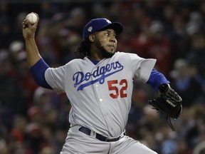 Los Angeles Dodgers' Pedro Baez throws during the seventh inning of Game 1 of the World Series baseball game against the Boston Red Sox Tuesday, Oct. 23, 2018, in Boston.