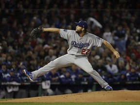 Los Angeles Dodgers pitcher Clayton Kershaw throws during the first inning of Game 1 of the World Series baseball game against the Boston Red Sox Tuesday, Oct. 23, 2018, in Boston.