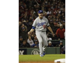 Los Angeles Dodgers pitcher Ryan Madson reacts after a near double during the fifth inning of Game 1 of the World Series baseball game against the Boston Red Sox Tuesday, Oct. 23, 2018, in Boston.