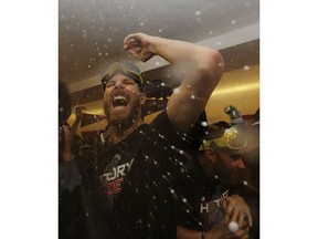 The Boston Red Sox Chris Sale celebrates in the clubhouse after Game 5 of baseball's World Series against the Los Angeles Dodgers on Sunday, Oct. 28, 2018, in Los Angeles. The Red Sox won 5-1 to win the series 4 games to 1.