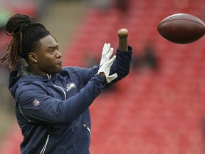 Seattle Seahawks linebacker Shaquem Griffin (49) catches the ball during the warm-up before an NFL football game against Oakland Raiders at Wembley stadium in London, Sunday, Oct. 14, 2018.