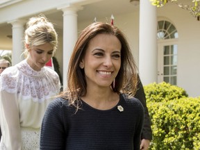 FILE - In this April 5, 2017 file photo, then White House Senior Counselor for Economic Initiatives Dina Powell, followed by Ivanka Trump, leaves a news conference in the Rose Garden at the White House in Washington. President Donald Trump says former aide Dina Powell is under consideration to replace departing U.N. Ambassador Nikki Haley.  Powell served as deputy national security adviser to Trump for most of his first year in the White House, departing in mid-January. She previously worked for Goldman Sachs and served in President George W. Bush's administration.  Trump told reporters Tuesday that he has heard his daughter Ivanka Trump's name discussed for the post. He says she'd be "incredible" in the role, but he knows if he selected her, he'd be accused of nepotism.