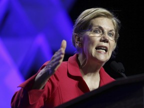 FILE - In this June 1, 2018 file photo, Sen. Elizabeth Warren, D-Mass., speaks at the 2018 Massachusetts Democratic Party Convention in Worcester, Mass.   Warren has released results of a DNA test showing Native American ancestry in an effort to diffuse the issue ahead of any presidential run.