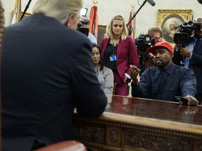 FILE - Oct. 11, 2018 file photo, Rapper Kanye West speaks during a meeting in the Oval Office of the White House with President Donald Trump, in Washington. It's one of President Donald Trump's favorite talking points in touting his administration's success: The record low rate of black unemployment.