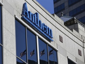 FILE - In this Feb. 5, 2015, file photo, the Anthem logo hangs at the health insurer's corporate headquarters in Indianapolis. Federal officials say the nation's second-largest health insurer will pay the government a record $16 million to settle potential violations of privacy requirements in a 2015 case that still stands the biggest health care hack in U.S. history.