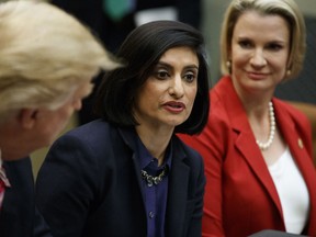 FILE - In this March 22, 2017, file photo, President Donald Trump , left, and Texas State Sen. Dawn Buckingham, right, listen as Administrator of the Centers for Medicare and Medicaid Services Seema Verma speaks during a meeting on women in healthcare in the Roosevelt Room of the White House in Washington. Medicare is modernizing its website to make it more useful for beneficiaries, particularly younger ones already going online for information from insurers, hospitals and doctors.