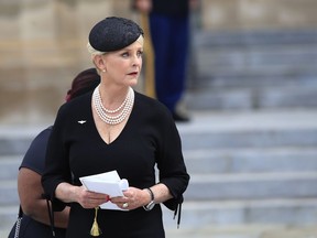 FILE - In this Sept. 1, 2018, file photo, Cindy McCain, glances back towards the hearse carrying her husband's casket, following a memorial service for her husband Sen. John McCain, R-Ariz., at the Washington National Cathedral in Washington. A nonprofit named for the late Sen. John McCain is calling for "mavericks" like him to vote in the Nov. 6 election and focus on human rights around the world. The McCain Institute for International Leadership, led by his widow, Cindy, is launching a nonpartisan campaign Tuesday, Oct. 23, to spread that message especially to young Americans.