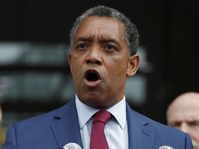 FILE - In this Oct. 5, 2017, file photo, District of Columbia Attorney General Karl Racine speaks at One Judiciary Square in Washington. Racine announced Tuesday, Oct. 23, 2018, that his office will open an investigation into sexual abuse by Catholic clergy in the local archdiocese.