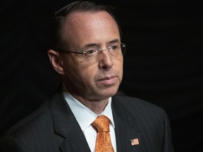 FILE - In this Oct. 17, 2018, file photo, Deputy Attorney General Rod Rosenstein pauses while speaking at the federal inspector general community's 21st annual awards ceremony in Washington. The top lawmakers on two House committees are postponing an interview with Rosenstein that was expected to delve into reports that he discussed secretly recording President Donald Trump.