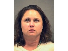 This image provided by the Alexandria Sheriff's Department shows a mug shot of Natalie Mayflower Edwards. Natalie Mayflower Sours Edwards, a Treasury Department employee, has been accused of leaking confidential banking reports of suspects charged in special counsel Robert Mueller's investigation.  (Alexandria Sheriff's Department via AP)